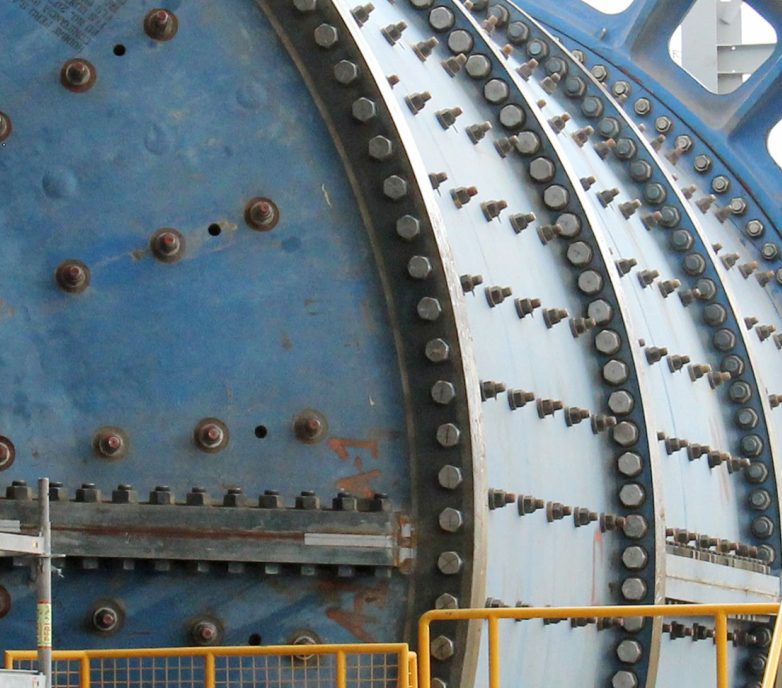 A review of operating data over 50 years of secondary crushing prior to AG/SAG mills